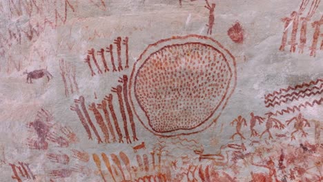 drone close-up crane shot of ancestral paintings in cerro azul, colombia