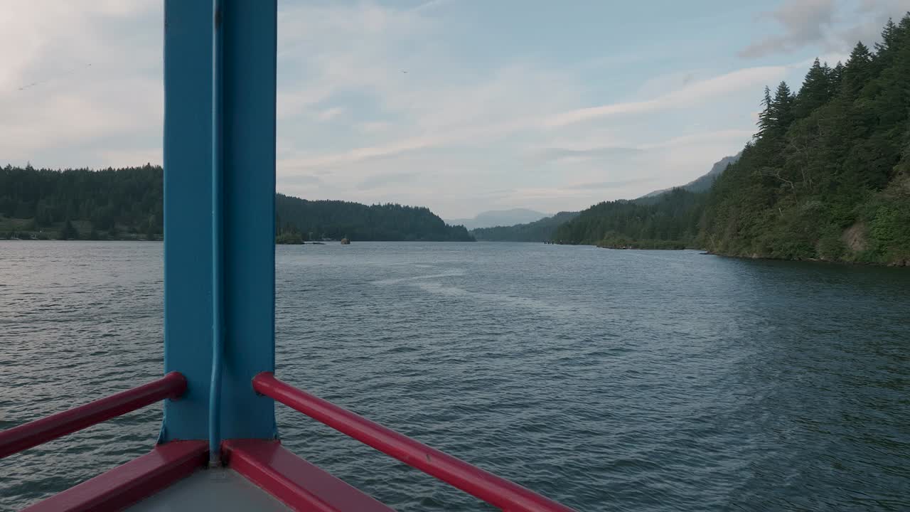 Cruise ship floating on Columbia RIver Gorge in Pacific Northwest Oregon point of view on a beautiful day