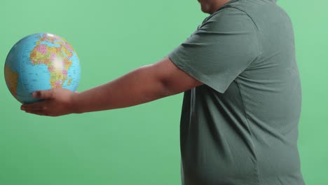 person holding a globe