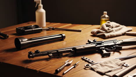 disassembled rifle and repair tools on a wooden table