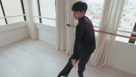 young male performer having contemporary dance practice