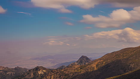 Timelapse-of-sky-partially-clouded,-sun-shining-over-mountains-of-Andalusia