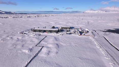 climeworks mammoth direct air capture facility in snowy iceland landscape, blue sky, aerial view