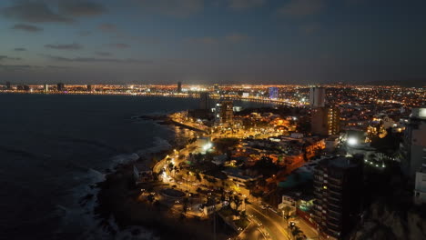 mazatlán malecon oceanfront seawall promenade, moody evening in mexico - aerial view