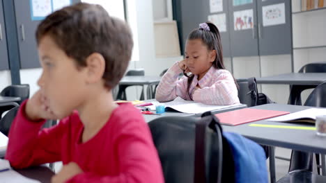 in school, children are focusing on their work in the classroom
