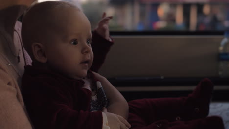 Excited-baby-girl-in-car-with-her-mother