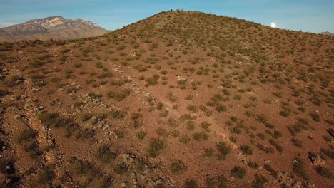 Drone-vista-aérea-of-a-photographer-standing-on-the-top-of-a-hill-overlooking-a-massive-solar-power-array-Primm-Nevada-1