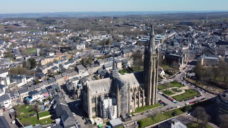aerial view of a town with a cathedral under renovation