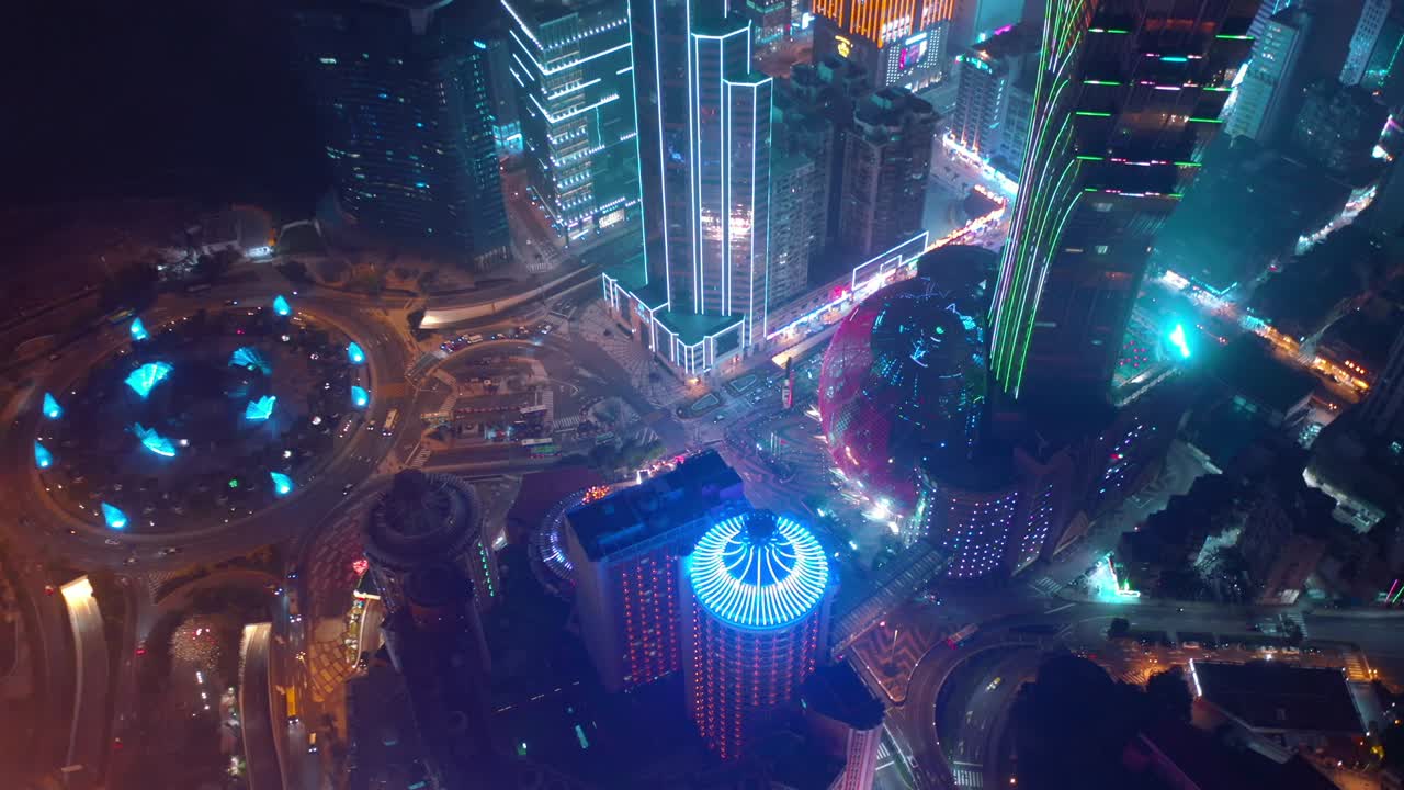 night illumination macau city bay downtown hotel traffic circle aerial topdown panorama 4k china