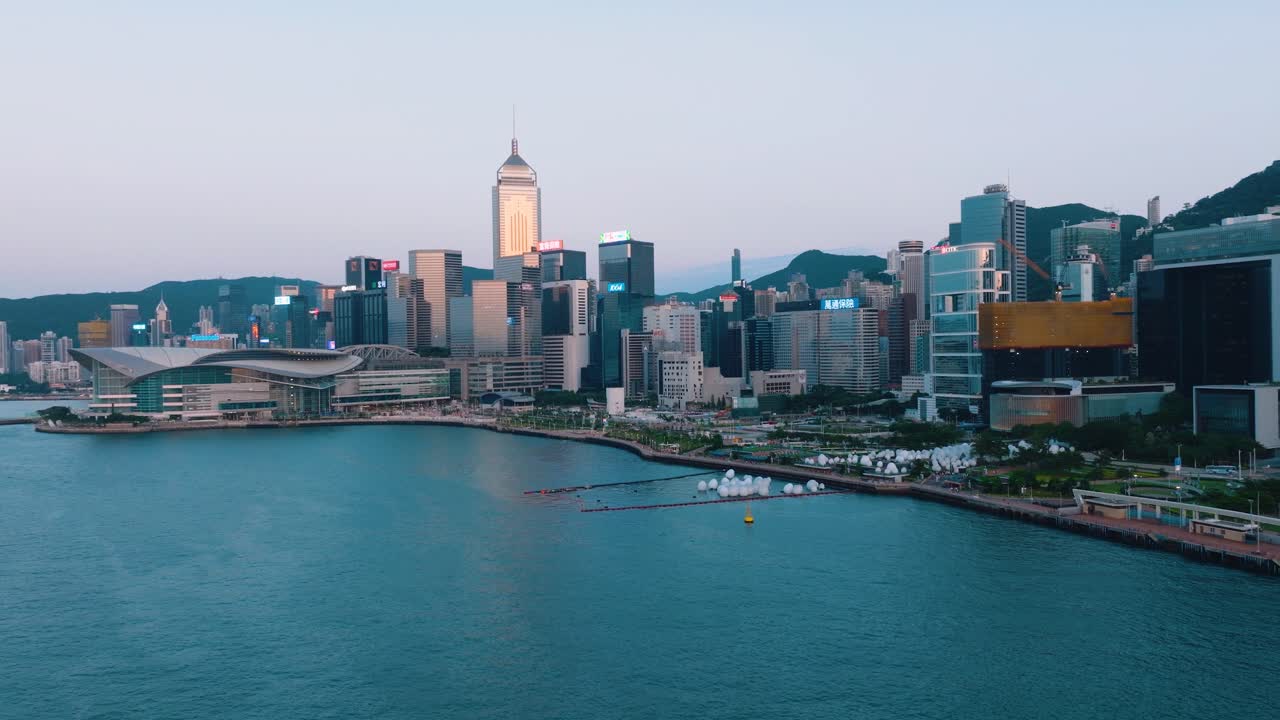 Moving aerial footage of beautiful sea in front of Downtown skyline during daytime.