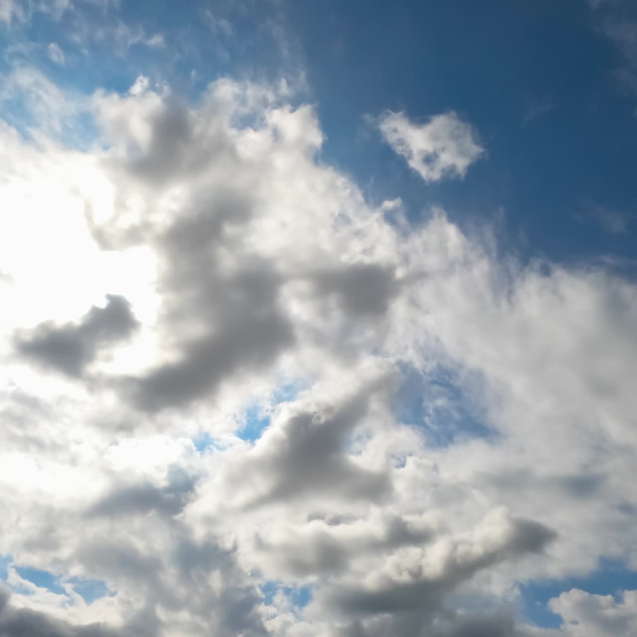 Heavy dark clouds gathering in the skies. Cloudscape quick formation timelapse. Low angle view