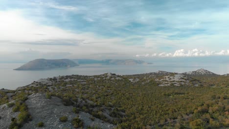 Aerial-drone-shot-of-rocky-seashore-and-islands-in-cloudy-day-3