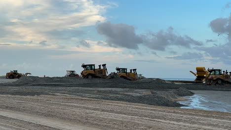 wide view, beach sand replenishment, construction equipment moving