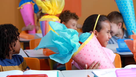 animation of school icons over schoolchildren and globe