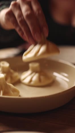 woman eating khinkali