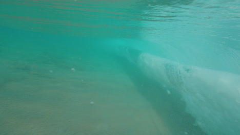 underwater view of turquoise ocean waves
