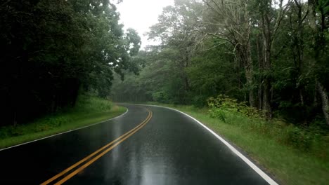 handheld footage from car interior during intense rainfall