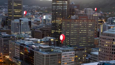 Location-pins-and-cityscape-at-dusk