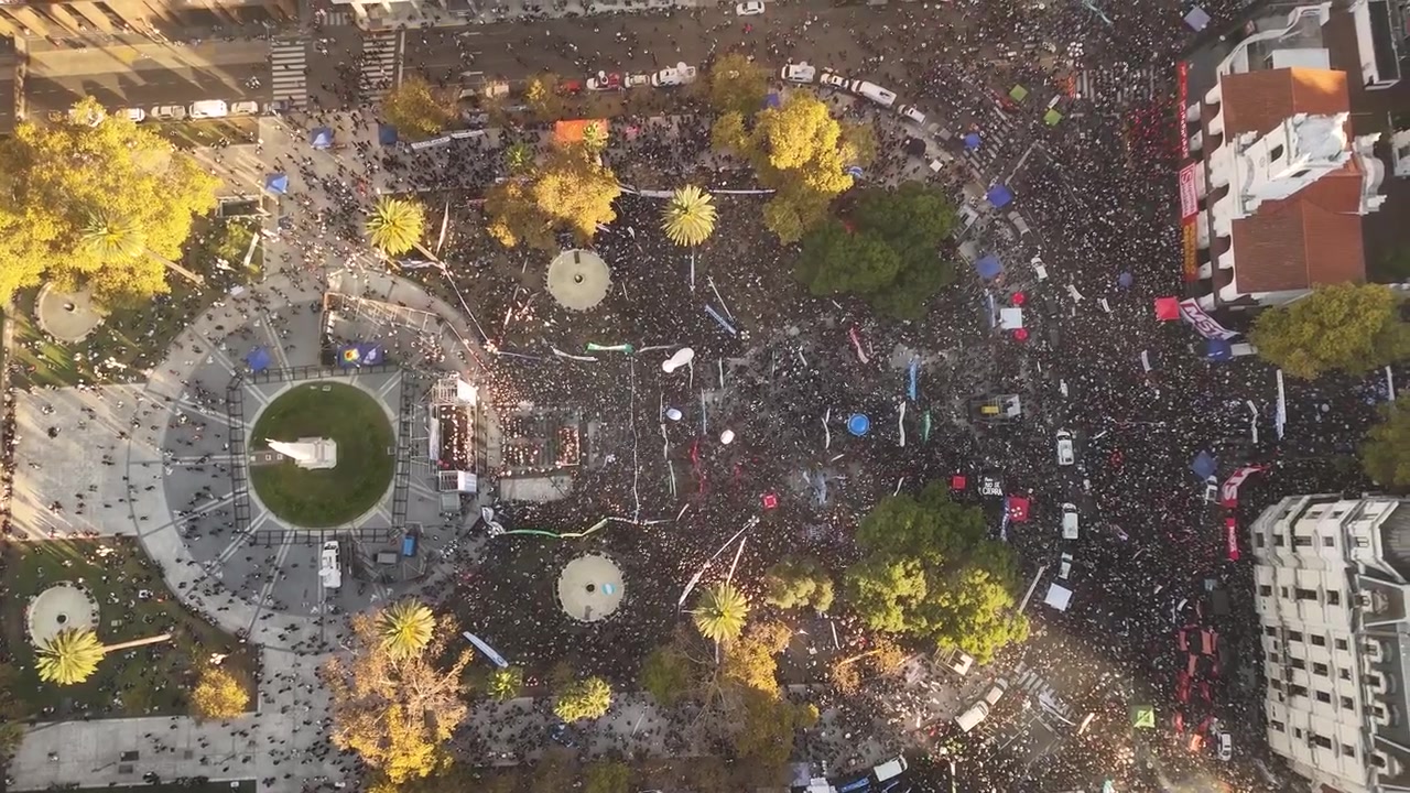 Massive crowd of protesters gathered for demonstration in Plaza de Mayo, Buenos Aires, Argentina. Aerial top-down view