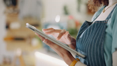 woman using a tablet in a small business setting