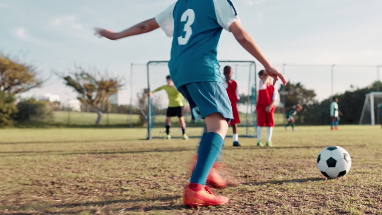 Children playing soccer game on a sunny day
