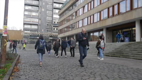 time lapse of busy urban scene outside university building in edinburgh