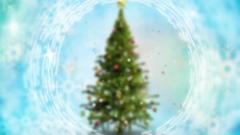 Animation of spinning shapes over blurred christmas tree