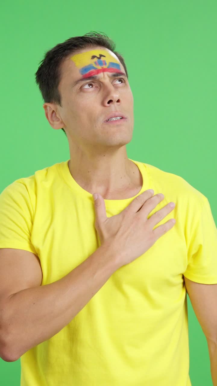Man listening to the Ecuador national anthem with solemnity