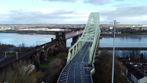 Charity-Santa-dash-fun-run-over-Runcorn-Silver-Jubilee-bridge-Aerial-view-wide-dolly-left