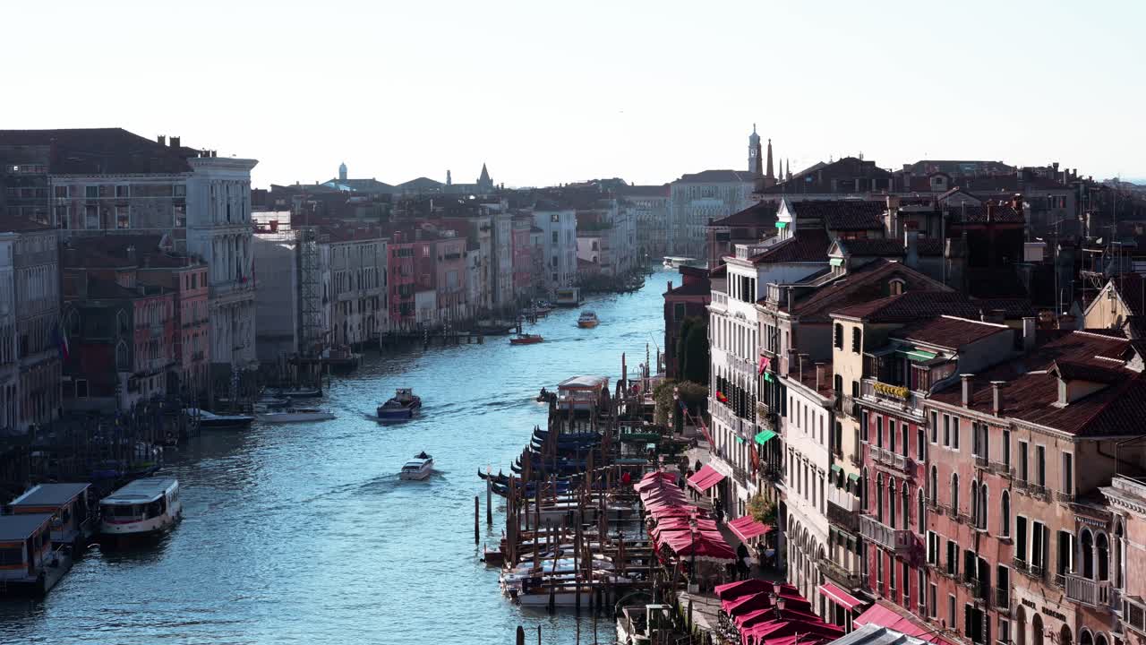 Stunning aerial footage showcasing the iconic canals of Venice, Italy. This shot captures the historic architecture, winding waterways, and timeless charm of the floating city.