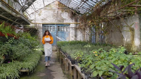 woman working in a greenhouse