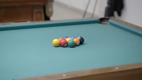 close view of the opening shot of a pool game