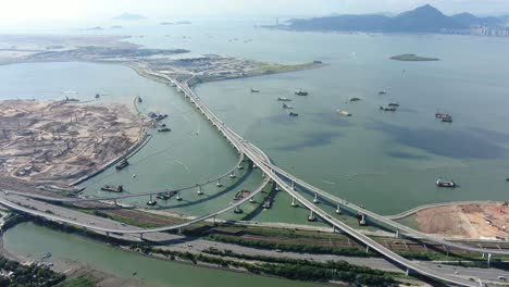 Instalaciones-De-Cruce-Fronterizo-De-Hong-Kong-Y-Puente-Principal-Y-Sistema-De-Carreteras-En-Construcción,-Vista-Aérea