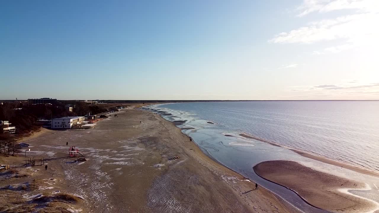 Aerial of empty Parnu beach in winter in Estonia