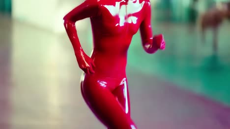 woman in red latex body suit