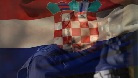 animation of flag of croatia over caucasian male soldier with weapon