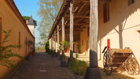 discover the tranquil beauty of francois mauriac's house, featuring rustic architecture, a serene courtyard, and lush greenery. perfect for capturing a peaceful atmosphere in a sunny setting