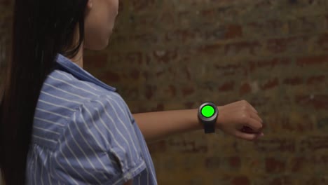 woman checking smartwatch