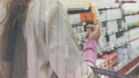 animation of data processing over caucasian woman with basket in shop