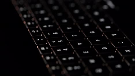 backlit computer keyboard in the dark