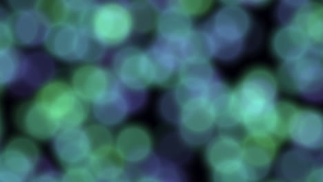 abstract art blurred blue and green circles on black background