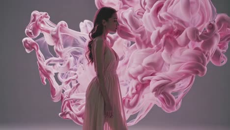 elegant woman in pink smoke