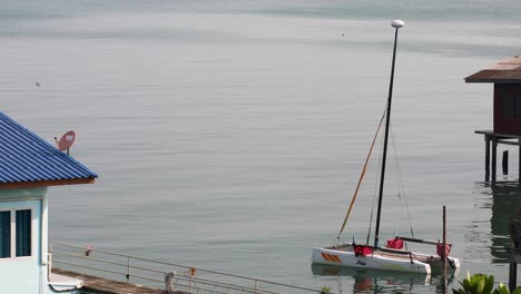 an anchored yacht at bangsaray in pattaya, thailand on calm waters