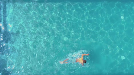 View-of-man-swimming-in-the-pool-at-the-hotel