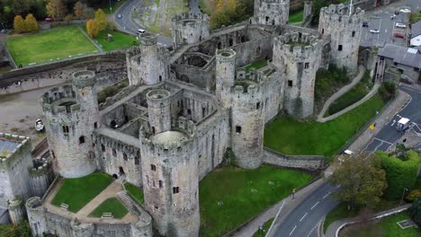 historic conwy castle aerial view of landmark town ruin stone wall battlements tourist attraction zooming in close