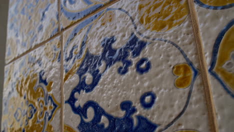 close-up of ornate blue and yellow decorative ceramic tiles