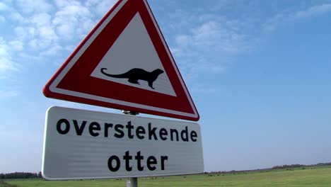 road sign of a crossing otter