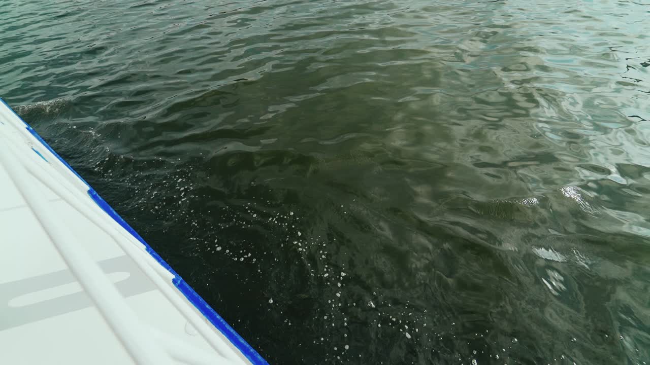 Woman with a mysterious look at sunset in Venice. Woman floating in a gondola on a river