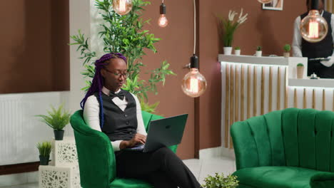 Front-desk-staff-working-on-laptop