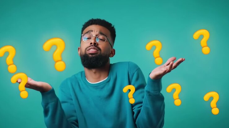 A video still of a puzzled man shrugging with question marks, shot from a front angle